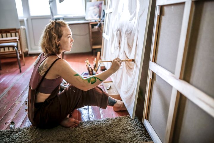 A stock image of an artist painting.