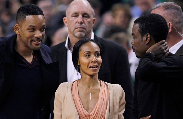 Will and Jada Pinkett Smith photographed with Chris Rock at an NBA game in May 2012