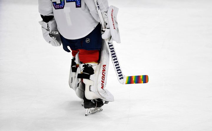 FILE - Florida Panthers goaltender Alex Lyon (34) warms up while celebrating Pride Night with a colorful hockey stick before playing the Toronto Maple Leafs, Thursday, March 23, 2023, in Sunrise, Fla. (AP Photo/Michael Laughlin, File)
