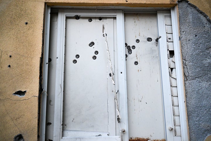 BE'ERI, ISRAEL - OCTOBER 11: A safe room window in a house is covered with bullet holes where dozens of civilians were killed days earlier by Hamas militants near the border with Gaza on October 11, 2023 in Be'eri, Israel. More than 100 civilians were killed at Kibbutz Be'eri which is about 12% of the kibbutz's population. Israel has sealed off Gaza and conducted airstrikes on Palestinian territory after an attack by Hamas killed hundreds and took more than 100 hostages. On October 7, the Palestinian militant group Hamas launched a surprise attack on Israel from Gaza by land, sea, and air, killing over 700 people and wounding more than 2000. Israeli soldiers and civilians have also been taken hostage by Hamas and moved into Gaza. The attack prompted a declaration of war by Israeli Prime Minister Benjamin Netanyahu. (Photo by Alexi J. Rosenfeld/Getty Images)