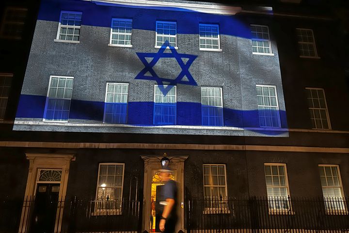 The flag of Israel is projected onto the front of 10 Downing Street in London, Sunday, Oct. 8, 2023, to show solidarity with Israel.