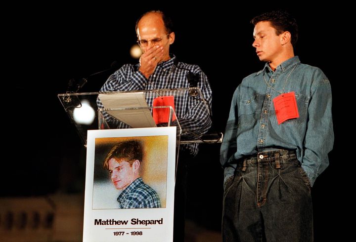 Matthew Shepard's friends Walter Boulden and Alex Trout get emotional as they speak during a national vigil on Oct. 14, 1998. 