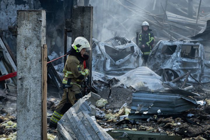 A Firefighter walks amid rubble at an industrial area after missile attack on September 21, 2023 in Kyiv, Ukraine