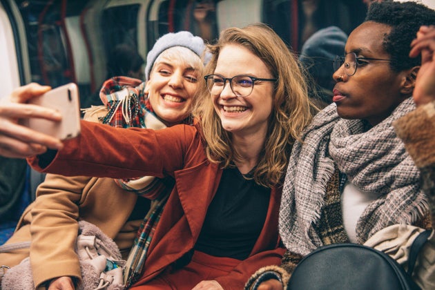Group of multi ethnic friends having fun together during a trip to UK.