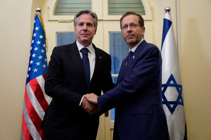 Israeli President Isaac Herzog (right) said "an entire nation out there that is responsible" for Hamas' Oct. 7 attack on Israel. Secretary of State Anthony Blinken (left)met with Herzog on Oct. 12.
