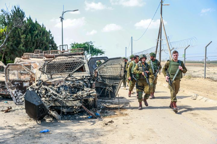 Israeli soldiers patrol the area as the traces of clashes between Israeli and Palestinian forces are seen in Be'eri, Israel on October 13, 2023. 