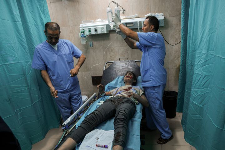 A Palestinian girl wounded during an Israeli airstrike receives medical treatment at al-Aqsa hospital in Deir el-Balah, central Gaza Strip, on Oct. 15, 2023. 