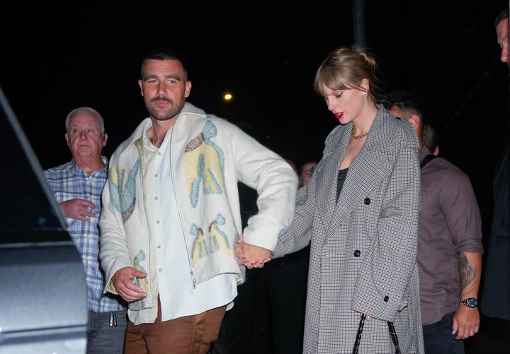 Travis Kelce and Taylor Swift depart the SNL Afterparty on October 15, 2023 in New York City.