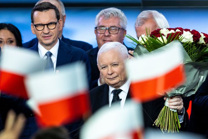 Jaroslaw Kaczynski (C ) leader of the ruling national-conservative Law and Justice (PiS) party, Prime Minister Mateusz Morawiecki ( L) during a speech to supporters after announcing the preliminary results of Poland's parliamentary elections, in Warsaw, October 15, 2023, Poland (Photo by Andrzej Iwanczuk/NurPhoto via Getty Images)