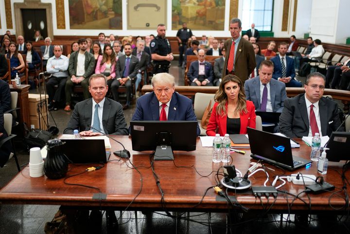 Former President Donald Trump, center, sits in the courtroom with his legal team before the continuation of his civil business fraud trial at New York Supreme Court, Oct. 3, 2023, in New York. Trump is returning Oct. 17 to the Manhattan civil fraud trial that threatens to upend his real estate empire. 