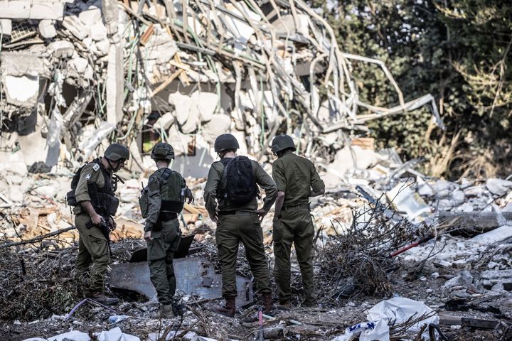 Israeli soldiers patrol the area as the traces of clashes between Israeli and Palestinian forces are seen in Be'eri, Israel on October 14, 2023. 