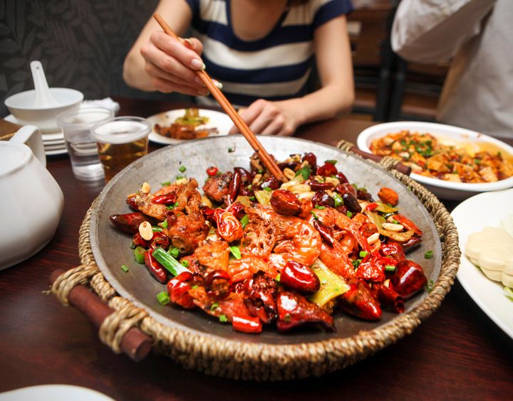 Everyone's tolerance for spicy foods (like this dish with Sichuan peppers) is different, and sometimes it's "more of a cultural thing than a physiological one," said gastroenterologist Lisa Ganjhu. 