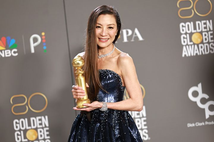 Yeoh poses in the press room with the award for Best Actress in a Motion Picture – Musical or Comedy for "Everything Everywhere All at Once" during the 80th Annual Golden Globe Awards on Jan. 10 in Beverly Hills. 