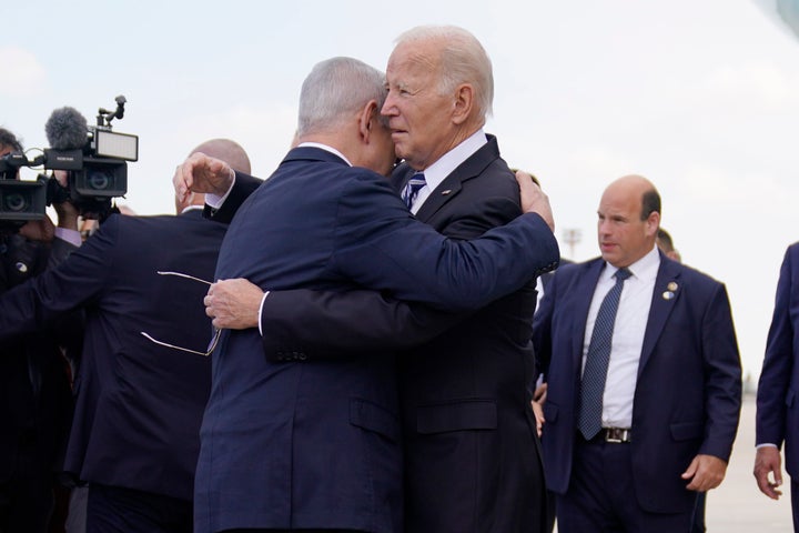 President Joe Biden hugs Israeli Prime Minister Benjamin Netanyahu after arriving at Ben Gurion International Airport, Wednesday, October 18, 2023, in Tel Aviv.