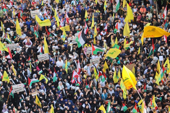 People take part in a demonstration organised by Lebanese Shiite group Hezbollah in the southern suburbs of Beirut on October 18, 2023, following a strike which ripped through a Gaza hospital compound killing hundreds the day before. Thousands rallied across the Arab world on October 18 to protest the deaths of hundreds of people in a strike on a Gaza hospital they blame on Israel, despite its denials. (Photo by ANWAR AMRO / AFP) (Photo by ANWAR AMRO/AFP via Getty Images)