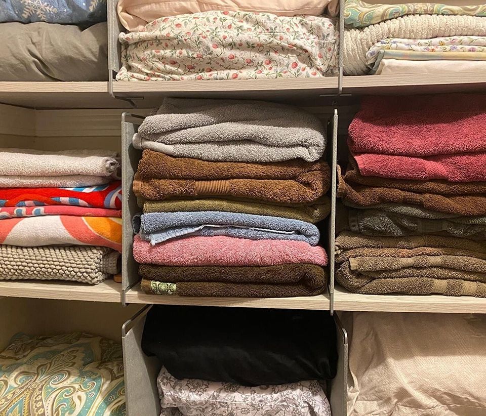 A set of shelf dividers if you've got piles of jeans, towels, and leggings that always start organized but eventually just become one messy super pile.