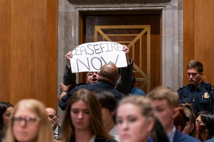 Capitol Police remove a protester from a Senate Foreign Relations Committee hearing on Wednesday, Oct. 18, in Washington.