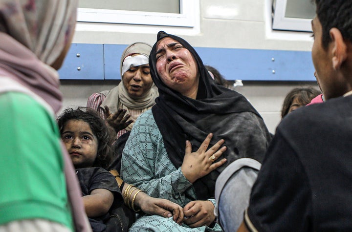 Wounded Palestinians wait for treatment in al-Shifa hospital in Gaza City, central Gaza Strip, after arriving from al-Ahli hospital following an explosion there, Tuesday, Oct. 17, 2023.