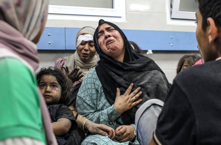 Wounded Palestinians wait for treatment in al-Shifa hospital in Gaza City, central Gaza Strip, after arriving from al-Ahli hospital following an explosion there, Tuesday, Oct. 17, 2023. 