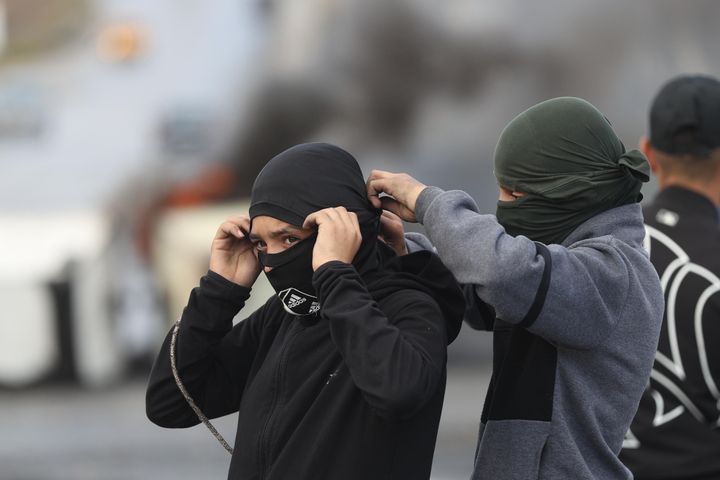 Protesters using slingshots throw rocks at Israeli forces as Israeli forces intervene a protest against yesterday's bombing of Al-Ahli Baptist Hospital in Ramallah, West Bank on October 18, 2023.