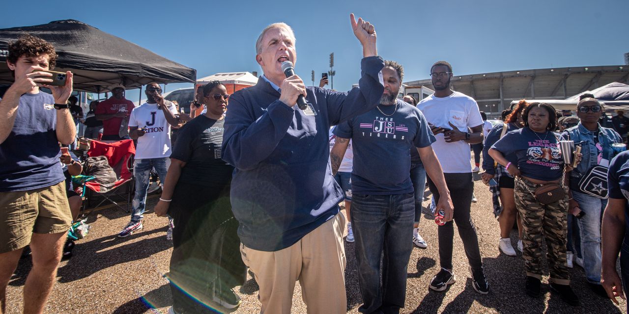 Presley speaks to a crowd of Jackson State University fans at the tailgate party on Oct. 14. He promised to beef up funding for HBCUs and return to homecoming every year.