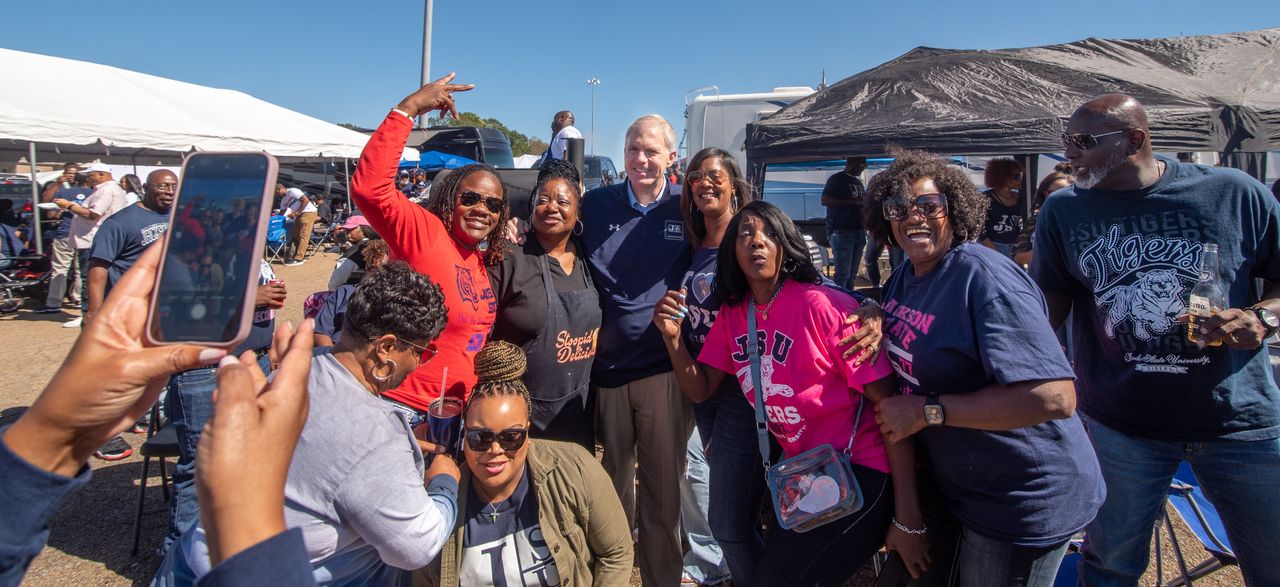 Presley takes photos with Jackson State University fans at the school's homecoming tailgate party on Oct. 14.