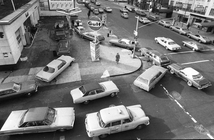 In this Dec. 23, 1973, file photo, cars line up in two directions at a gas station in New York City. Of all the bad memories seared into the American consciousness from the early 1970s, the never-ending lines at the gas pump has to top the list. The U.S., seemingly awash in crude oil after an energy boom sent thousands of workers scurrying to the plains of Texas and North Dakota, will begin exporting oil for the first time since the 1973 oil embargo.