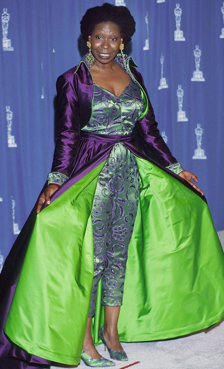 Goldberg wore a dark purple and lime green jumpsuit, matching bolero-like jacket and shoes.