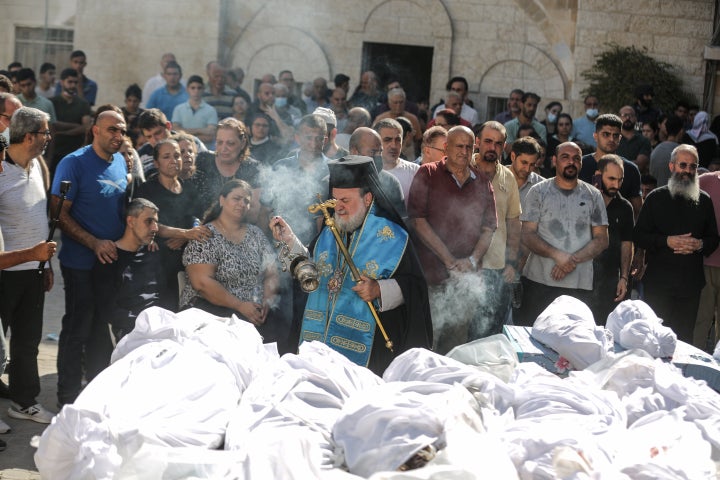 GAZA CITY, GAZA - OCTOBER 20: People attend the funeral ceremony for Palestinians who lost their lives in Israeli attack on Church of Saint Porphyrius in Gaza City, Gaza on October 20, 2023. (Photo by Ali Jadallah/Anadolu via Getty Images)