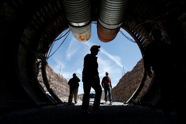 In this April 9, 2015, file photo, people walk into the south portal of Yucca Mountain during a congressional tour of the proposed radioactive waste dump near Mercury, Nev., 90 miles northwest of Las Vegas.