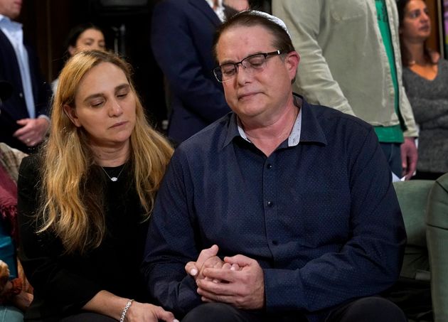 Sigal Zamir, the sister of Natalie Raanan's father Uri, attends a prayer vigil with her husband Avi in Evanston, Illinois, on Oct. 12. The vigil was for Natalie and her mother Judith Raanan, who went missing while visiting relatives in Israel.