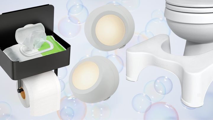 A toilet paper holder with storage, two rotational GE nightlights and a Squatty Potty toilet stool from Amazon.
