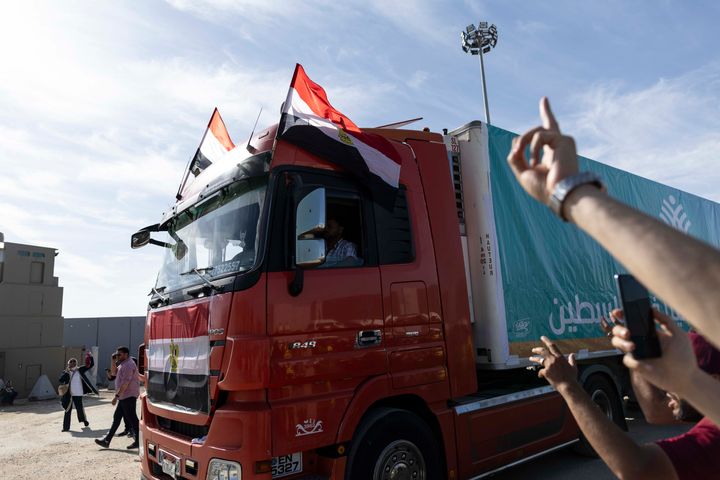 NORTH SINAI, EGYPT - OCTOBER 21: Aid convoy trucks make their way to cross the Rafah border from the Egyptian side on October 21, 2023 in North Sinai, Egypt. The aid convoy, organized by a group of Egyptian NGOs, set off last weekend from Cairo for the Gaza-Egypt border crossing at Rafah. A week of negotiations followed about when the border, controlled by Egypt on one side and Hamas on the other, would be opened, until the first trucks were admitted on Saturday. (Photo by Mahmoud Khaled/Getty Images)