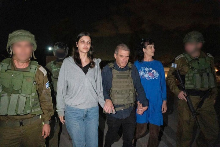 In this photo provided by the Government of Israel, Judith Raanan, right, and her 17-year-old daughter Natalie are escorted by Israeli soldiers and Gal Hirsch, Prime Minister Benjamin Netanyahu's special coordinator for returning the hostages, as they return to Israel from captivity in the Gaza Strip, Friday, Oct. 20, 2023. Hamas released the pair in what it said was a goodwill gesture late Friday, nearly two weeks after they were captured in a bloody cross-border raid by the Islamic militant group. The Hamas attack sparked a war that is entering its third week, and Hamas is believed to still be holding some 200 people hostage. (Government of Israel via AP Photo)