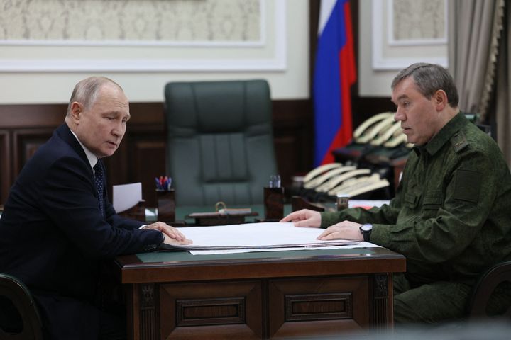 Vladimir Putin with Russian Army chief of staff Valery Gerasimov at the military headquarters in Rostov-on-Don.