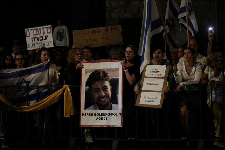 Israelis hold signs and photos of those who were kidnapped by Hamas militants during a protest calling for their return, in Jerusalem, on Oct. 22, 2023. 