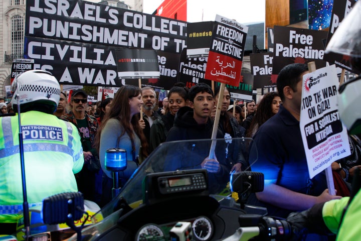 Police motorcyclists try to get through the crowd of protesters during a pro Palestinian demonstration