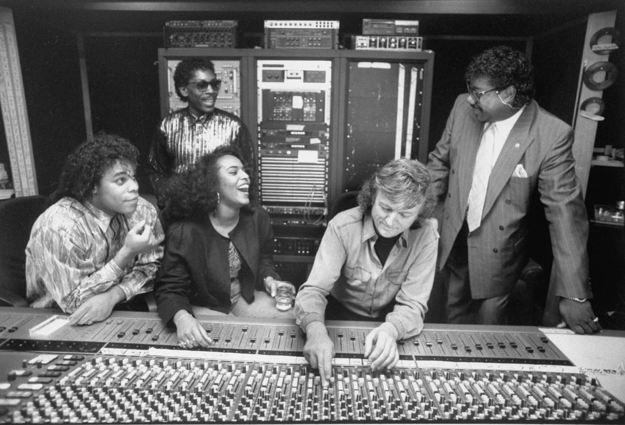Four of the actual singers behind Milli Vanilli. (Left to right) Ray Horton, John Davis, Gina Mohammed, Frank Farian and Brad Howell at control board in recording studio. 
