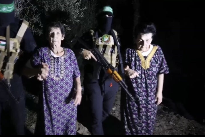 A screen grab captured from a video shows Hamas' Al-Qassam Brigades "unilaterally" released 2 civilian prisoners in Gaza on Oct. 24, 2023.