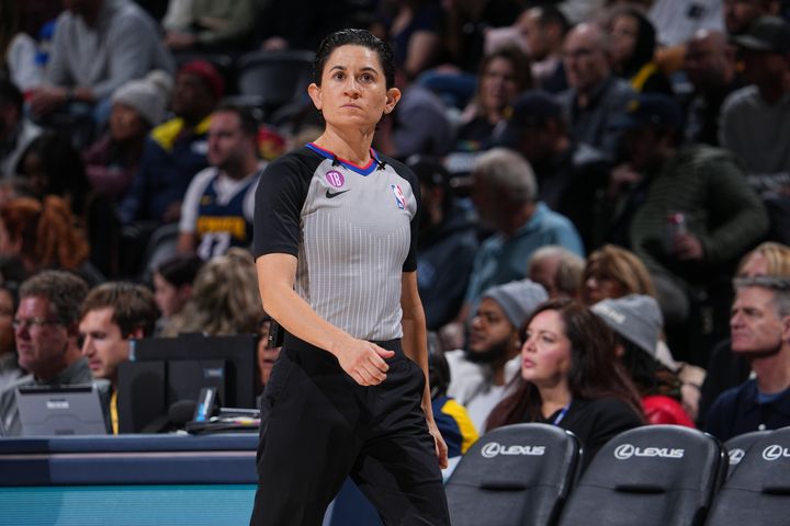 NBA referee Che Flores, pictured working a Rockets-Nuggets game on Nov. 30, 2022, said that being previously misgendered "felt like a little jab in the gut."