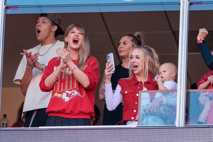 Taylor Swift watches the game with Brittany Mahomes (right, with the baby) on Oct. 22 at Arrowhead Stadium in Kansas City, Missouri.