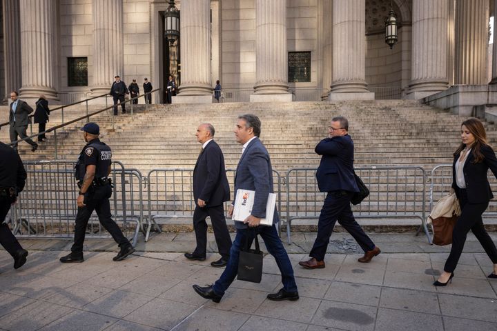 Michael Cohen walks by members of media as he arrives for former President Donald Trump's civil business fraud trial at New York Supreme Court, Tuesday, Oct. 24, 2023, in New York. (AP Photo/Yuki Iwamura)