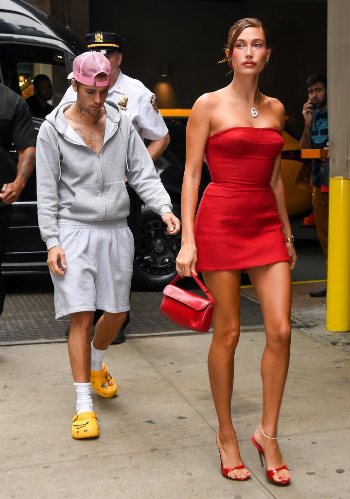 Justin Bieber and Hailey Bieber caused a commotion with their very different outfits during an August event at a Times Square Krispy Kreme doughnut shop. Now she's explaining why the couple rarely coordinates.