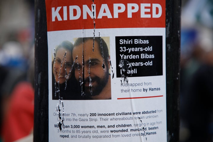 A damaged poster on a lamppost shows an image of Israeli citizens who have allegedly been kidnapped by the militant group Hamas, during a pro-Palestinian demonstration in London, Saturday, Oct. 21, 2023.