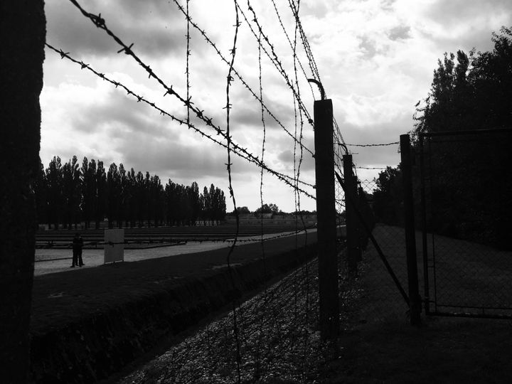 A barbed wire fence at Dachau concentration camp.