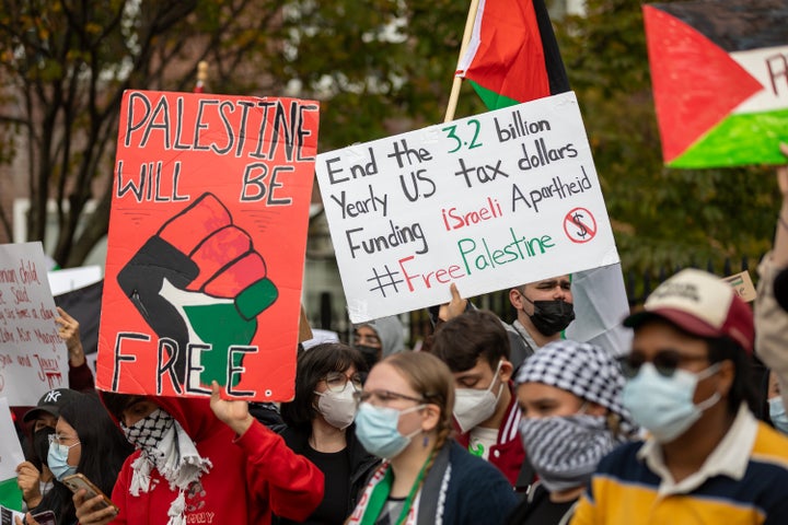 Students from Brooklyn College and supporters hold signs during a pro-Palestinian demonstration at the entrance of the campus on Oct. 12. Students for Justice In Palestine (SJP) held protests in colleges across the nation to show solidarity with Palestine.