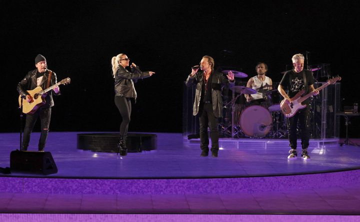 Lady Gaga (2nd L), The Edge, Bono, Bram van den Berg, and Adam Clayton of U2 perform onstage at U2:UV Achtung Baby Live at Sphere on October 25