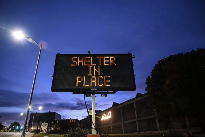 A view of the street while police officers close the road as they patrol around the street during inspection after a gunman's multiple shootings in Maine on October 26, 2023. At least 22 people have been reportedly killed and as many as 60 wounded after a gunman went on a shooting spree.