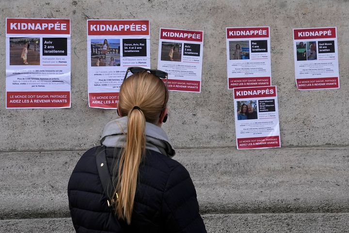A woman looks at posters pasted by the UEJF (Union of Jewish French Students) on Oct. 16 in Paris.