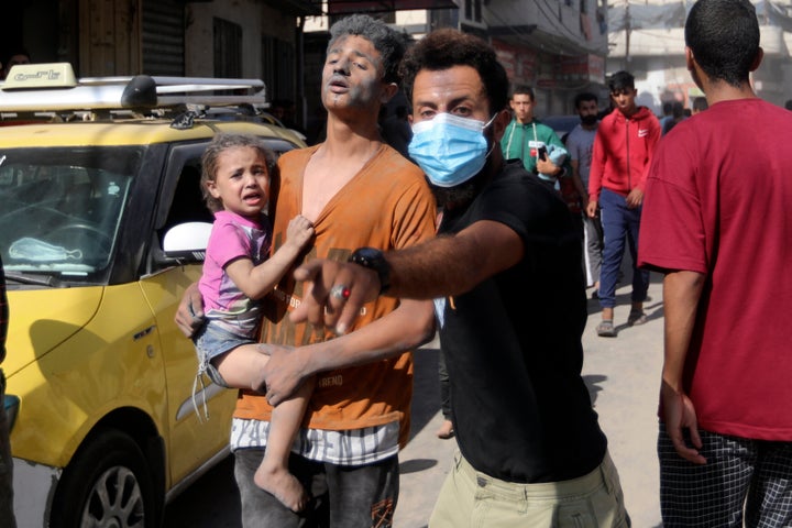 Injured Palestinians are evacuated following Israeli airstrikes on town of Khan Younis, southern Gaza Strip, on Oct. 26, 2023.